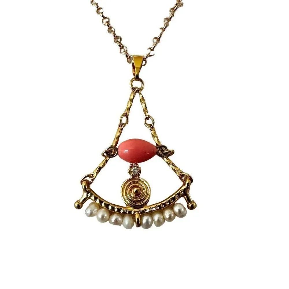 Gold tone faux pearl and orange pendant necklace